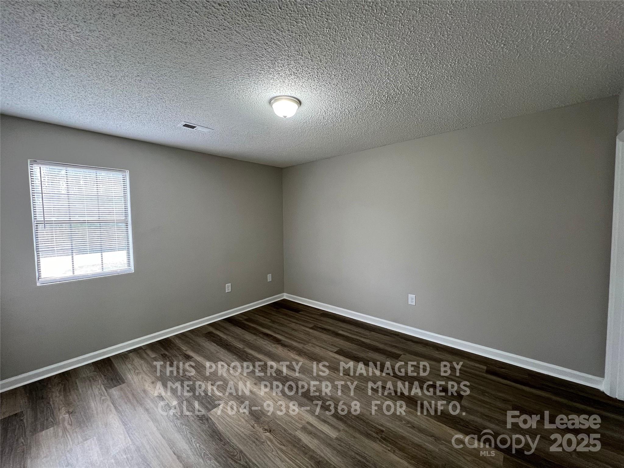 311 Rustic Road Mooresville, NC 28115 - Photo 8 of 10 a view of an empty room and window