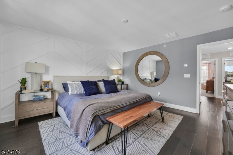 2 Doherty Way Morris Plains, NJ 07950 - Photo 21 of 33 a bedroom with a bed a mirror and lamp on desk