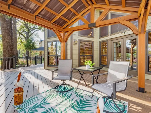a view of a patio with table and chairs