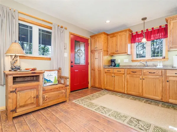 a kitchen with a sink stove and cabinets