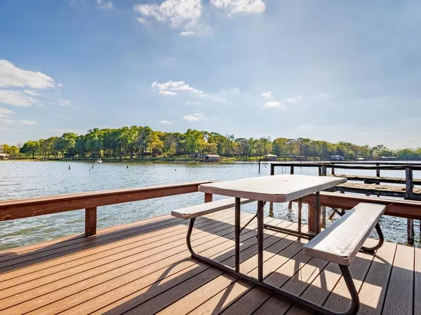 a view of a terrace with seating area and wooden floor