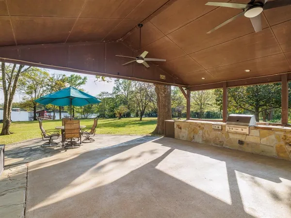 a view of a swimming pool with a patio