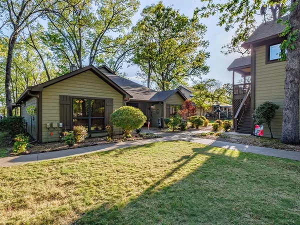 a view of a house with swimming pool and sitting area