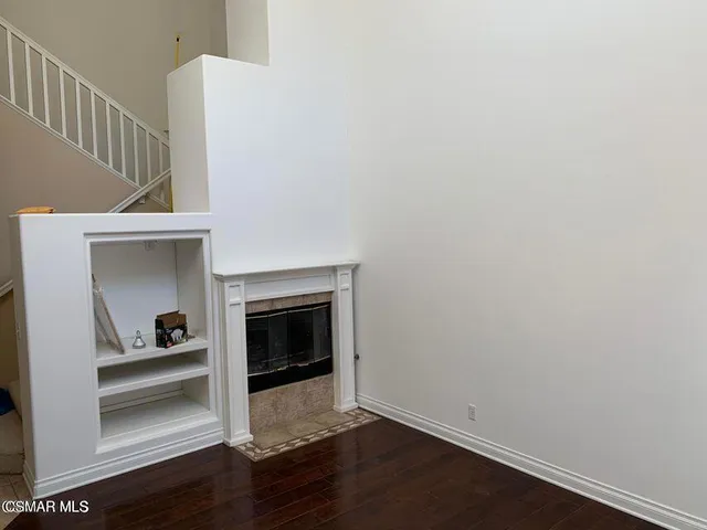 a view of a livingroom with wooden floor