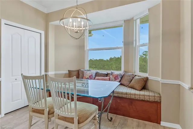 a view of a dining room with furniture window and outside view