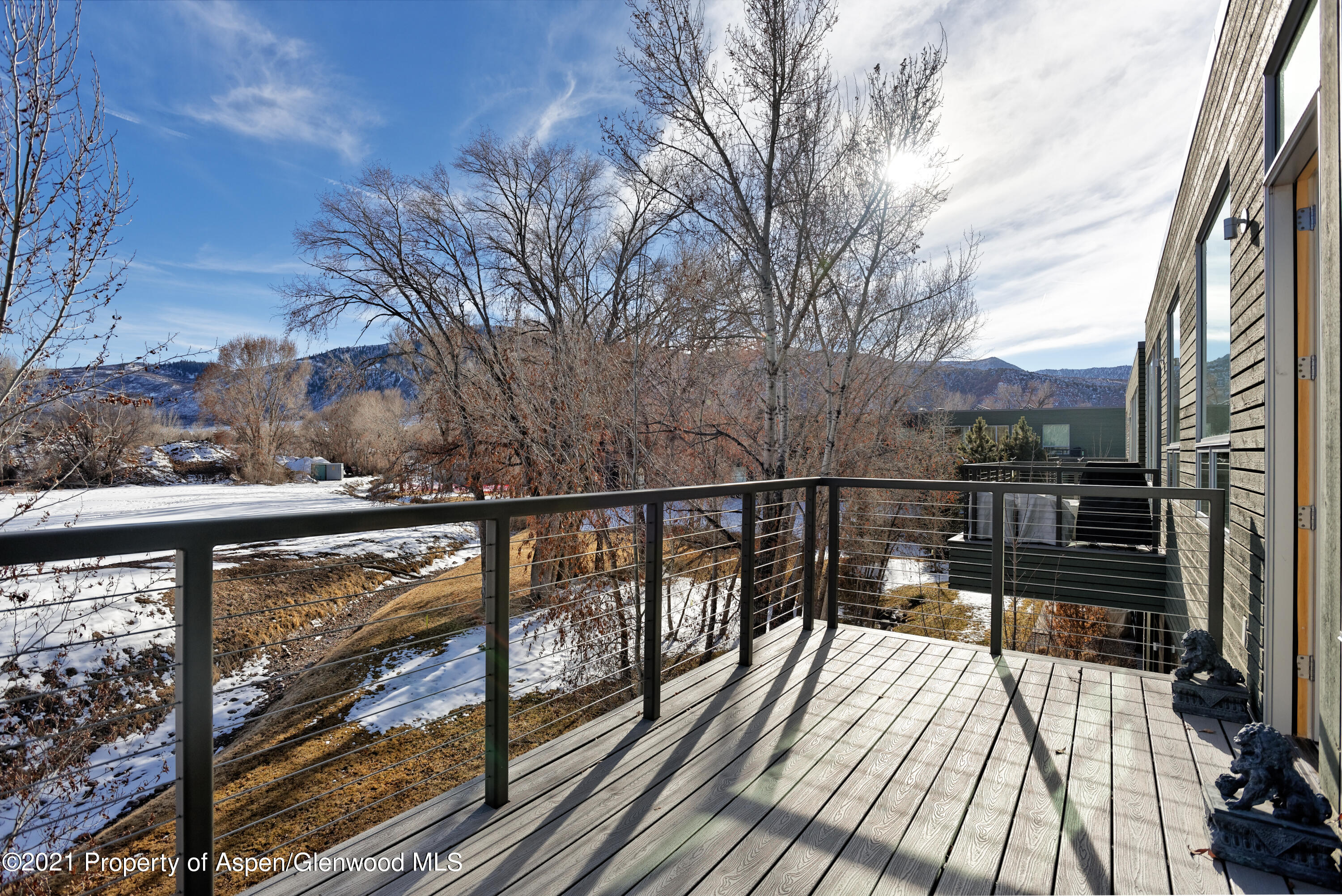 104 Evans Road, Unit 205 Basalt, CO 81621 - Photo 13 of 16 a view of balcony with wooden floor and fence