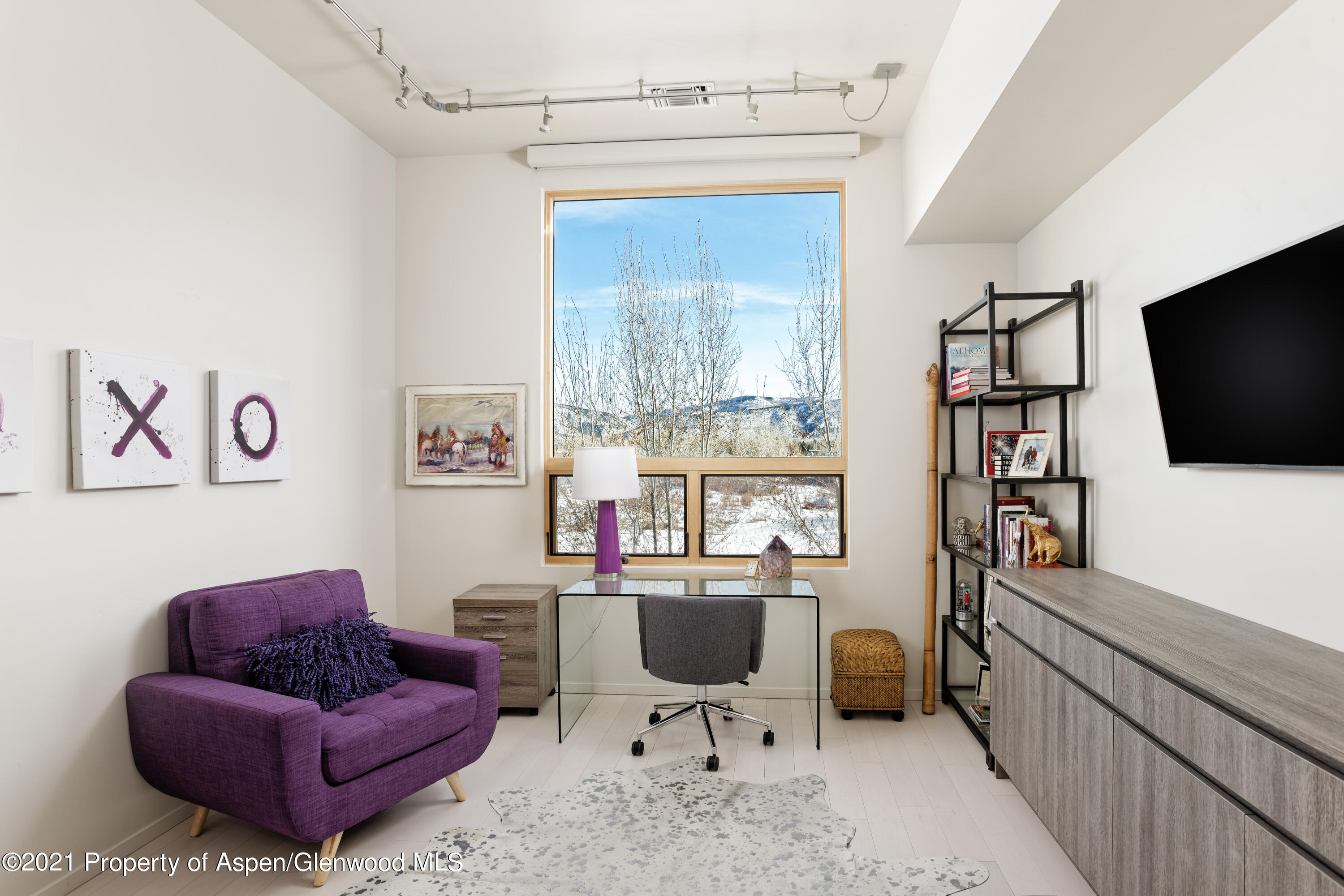 104 Evans Road, Unit 205 Basalt, CO 81621 - Photo 15 of 16 a living room with furniture and a flat screen tv