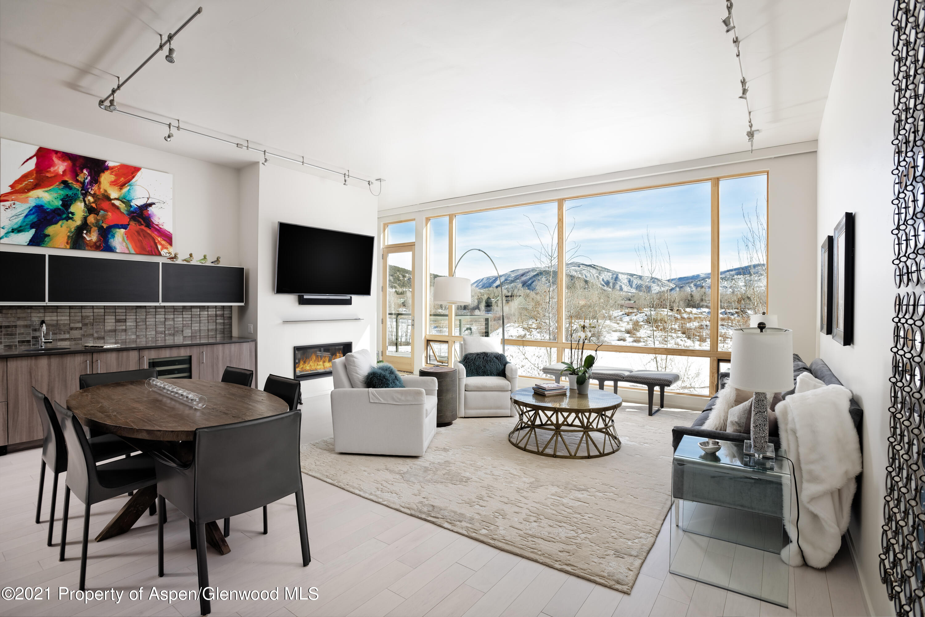 104 Evans Road, Unit 205 Basalt, CO 81621 - Photo 3 of 16 a living room with fireplace furniture and a flat screen tv