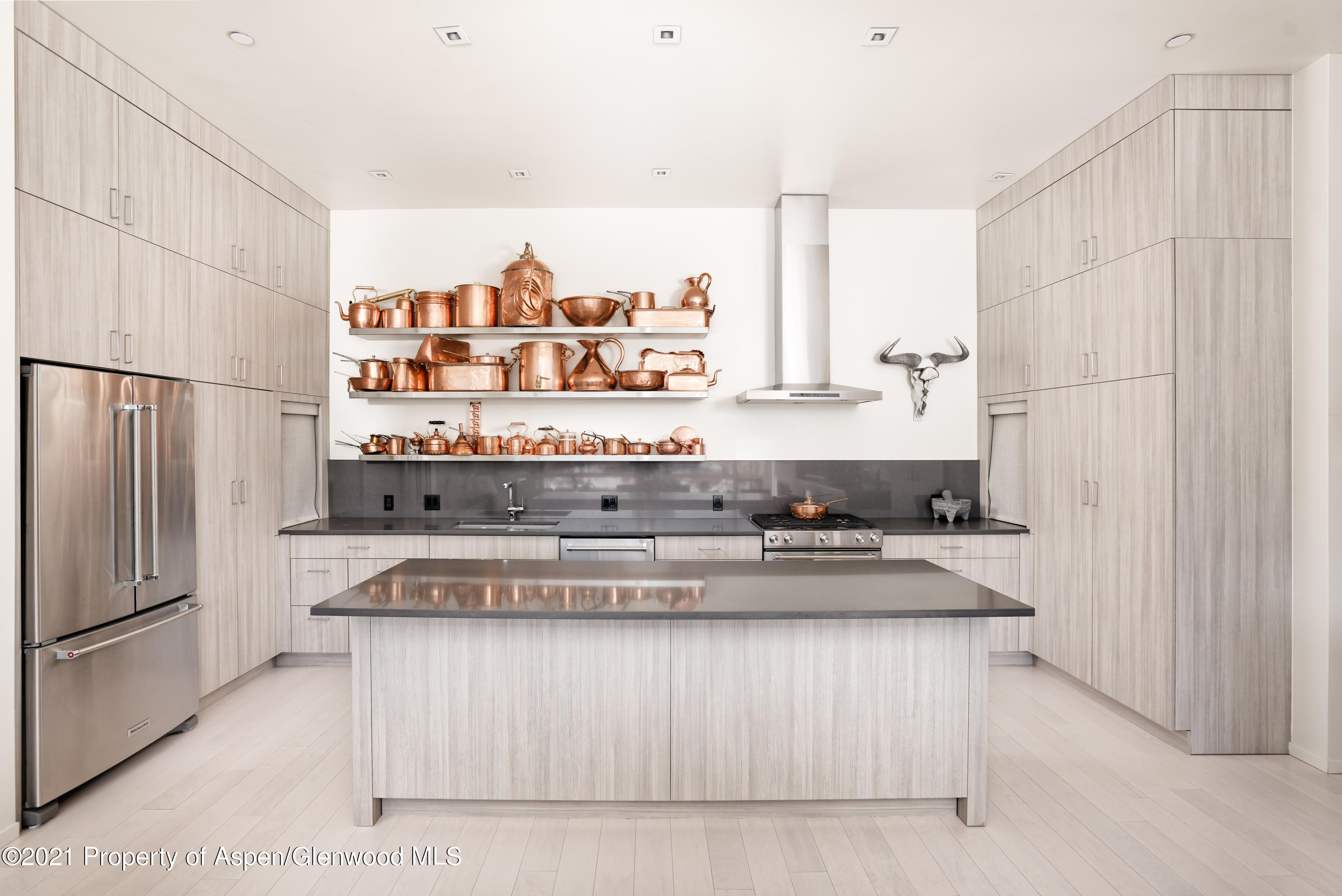 104 Evans Road, Unit 205 Basalt, CO 81621 - Photo 5 of 16 a kitchen with stainless steel appliances granite countertop a stove and a refrigerator