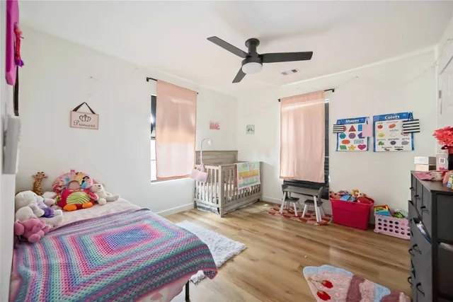 a bedroom with a bed and furniture