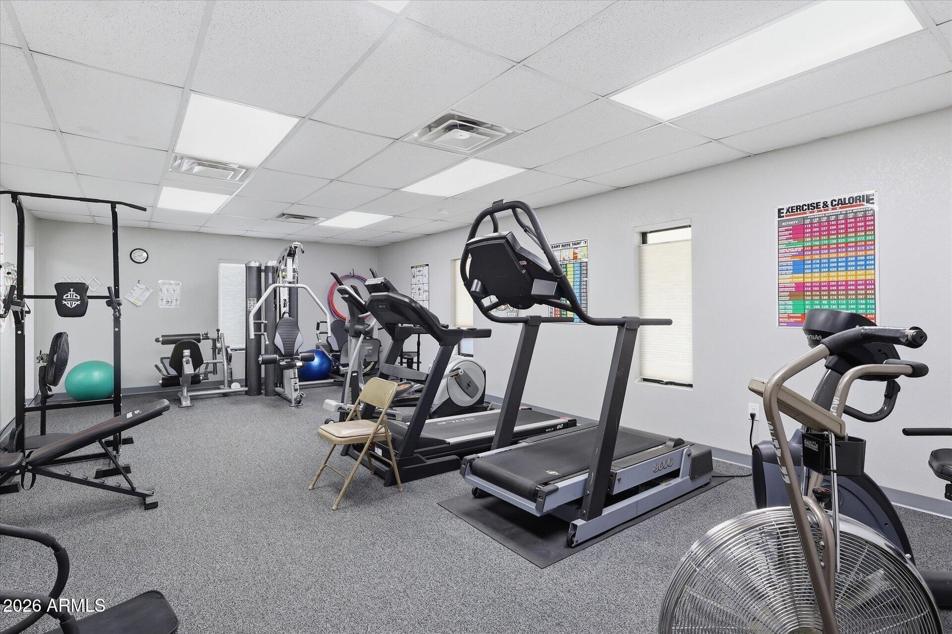 3270 South Goldfield Road, Unit 716 Apache Junction, AZ 85119 - Photo 29 of 36 a view of a room with gym equipment