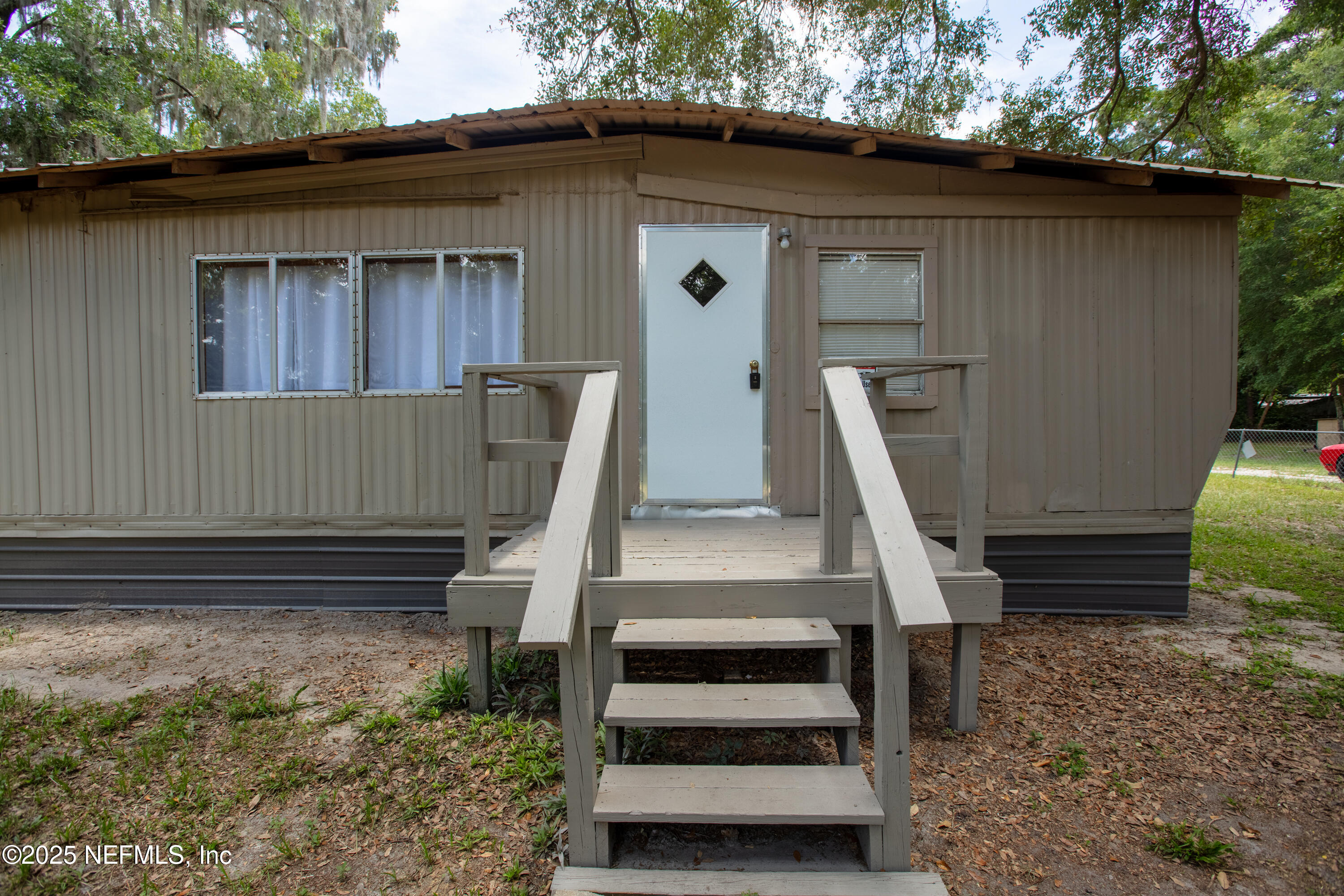 6398 Cascade Drive Keystone Heights, FL 32656 - Photo 12 of 31 a front view of a house with a garden