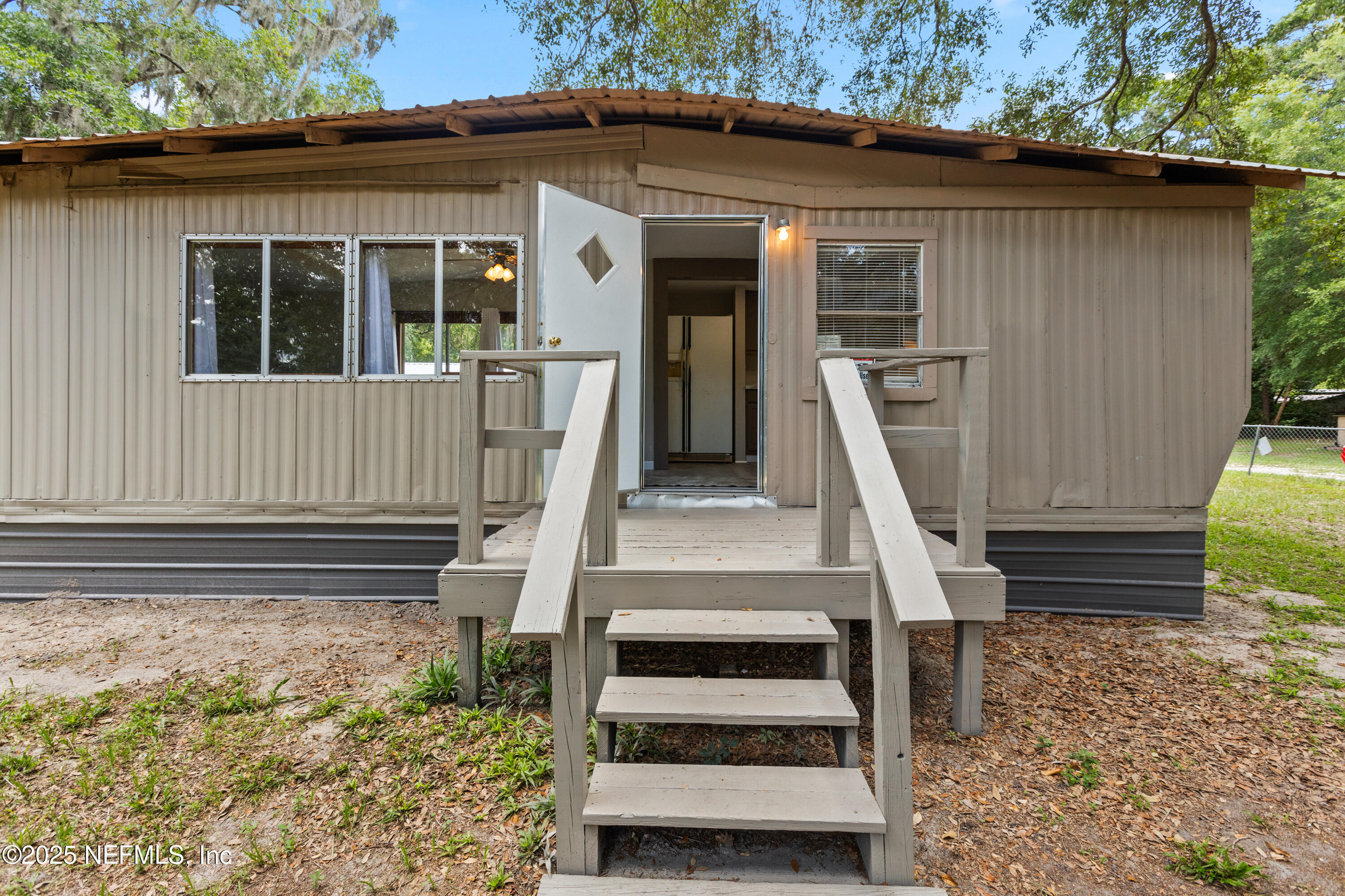 6398 Cascade Drive Keystone Heights, FL 32656 - Photo 13 of 31 a front view of a house with a garden