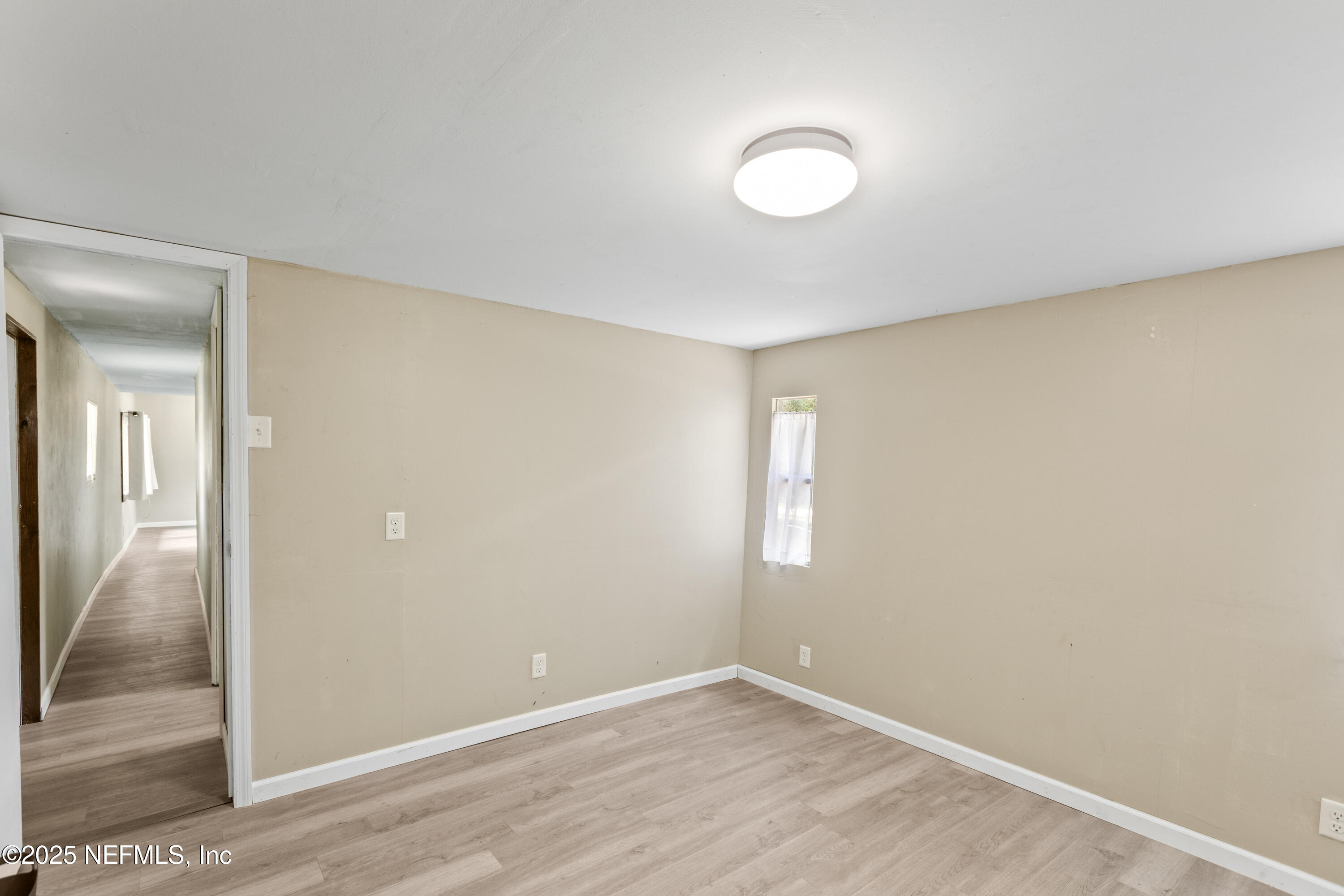 6398 Cascade Drive Keystone Heights, FL 32656 - Photo 28 of 31 an empty room with windows and entrance