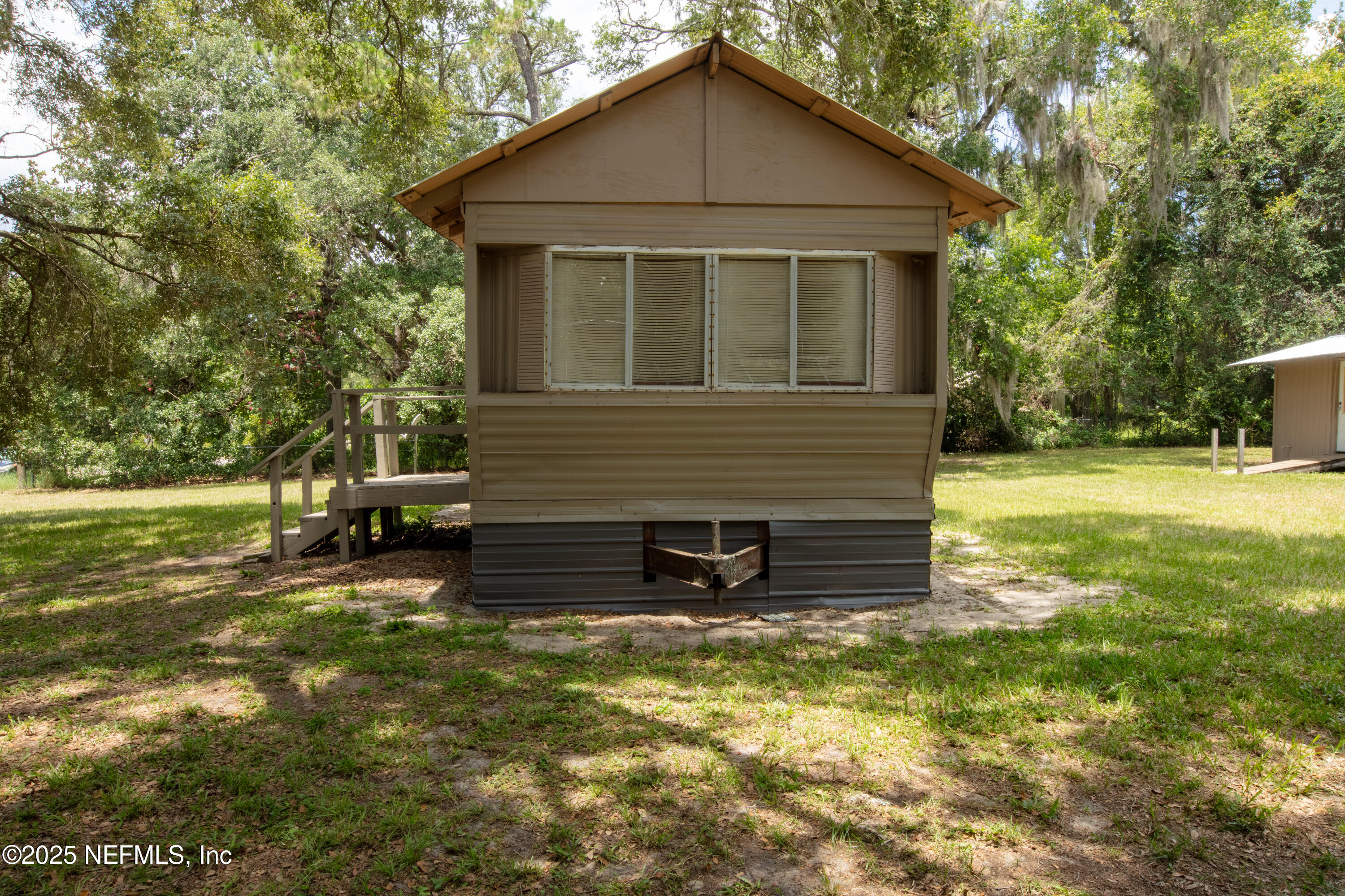 6398 Cascade Drive Keystone Heights, FL 32656 - Photo 5 of 31 a view of a house with a yard