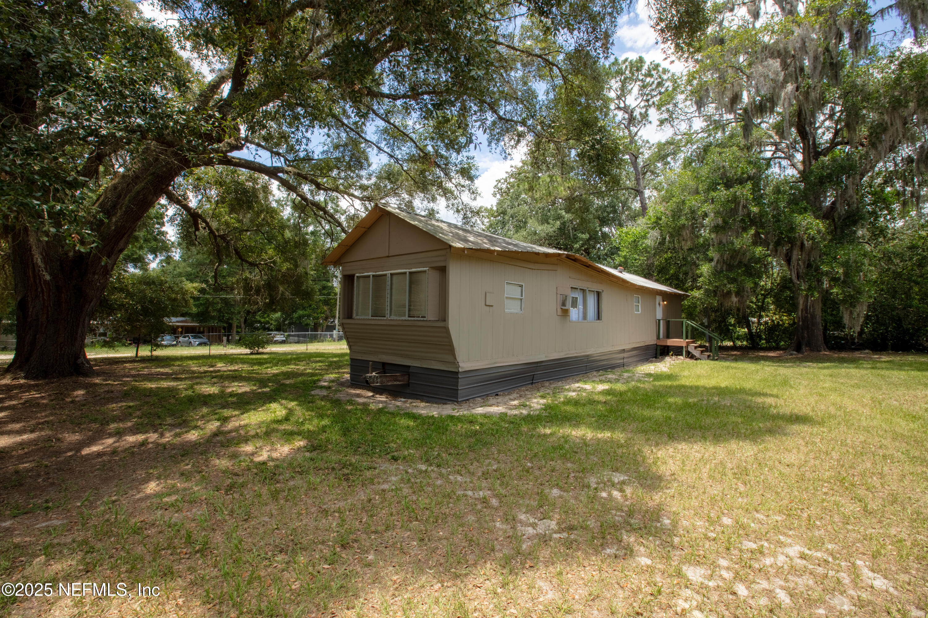 6398 Cascade Drive Keystone Heights, FL 32656 - Photo 7 of 31 a view of a house with backyard