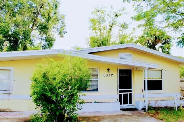 a view of a backyard of the house