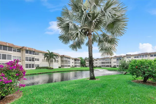 a view of a lake with a building in the background