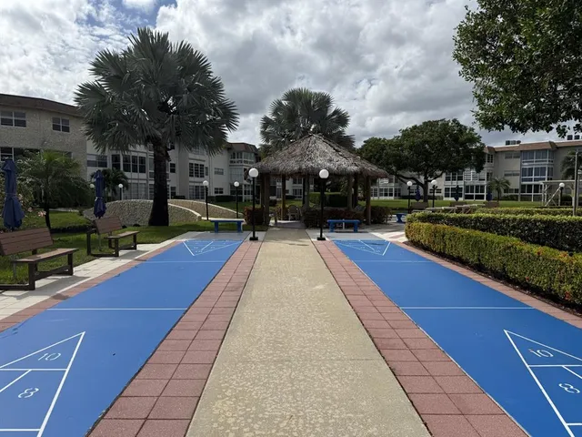 a view of swimming pool outdoor seating and city view