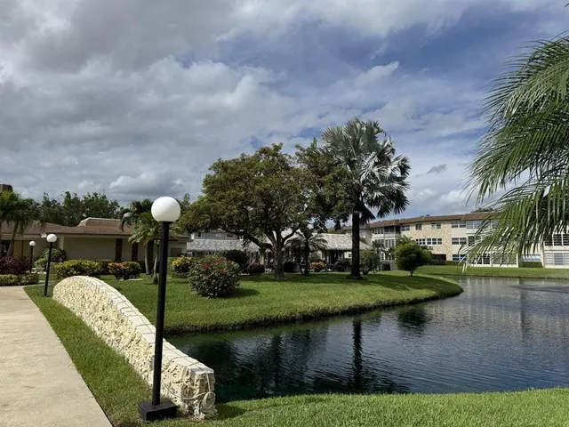 a view of a lake with a garden