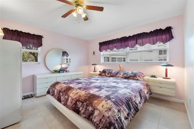 a bed room with a bed and a painting