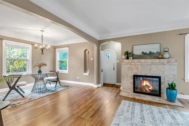 a view of an empty room with window and fire place