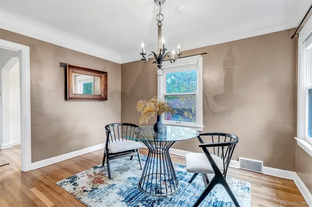 a view of living room with furniture and wooden floor