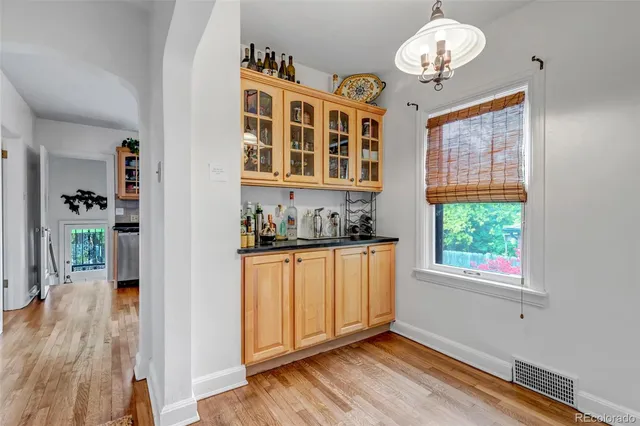a kitchen with stainless steel appliances granite countertop a stove and cabinets