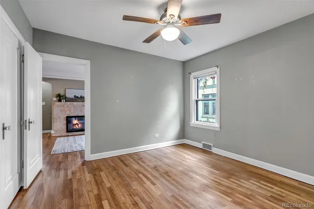 a view of walk in closet with empty racks
