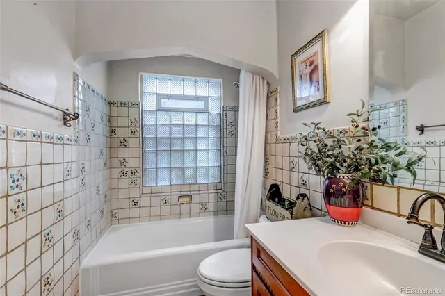a view of a livingroom with furniture and a flat screen tv