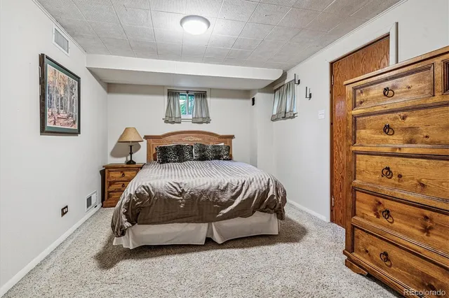a view of a pathway of a building with wooden fence