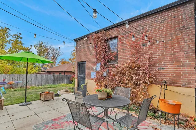 a view of a chairs and table in the patio