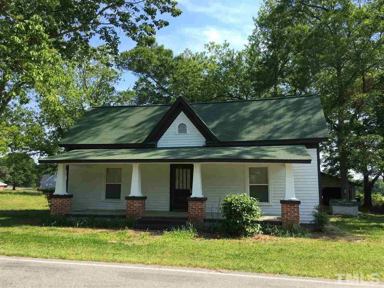 804 Pine Ridge Road Zebulon, NC 27597 - Photo 1 of 12 front view of a house with a yard
