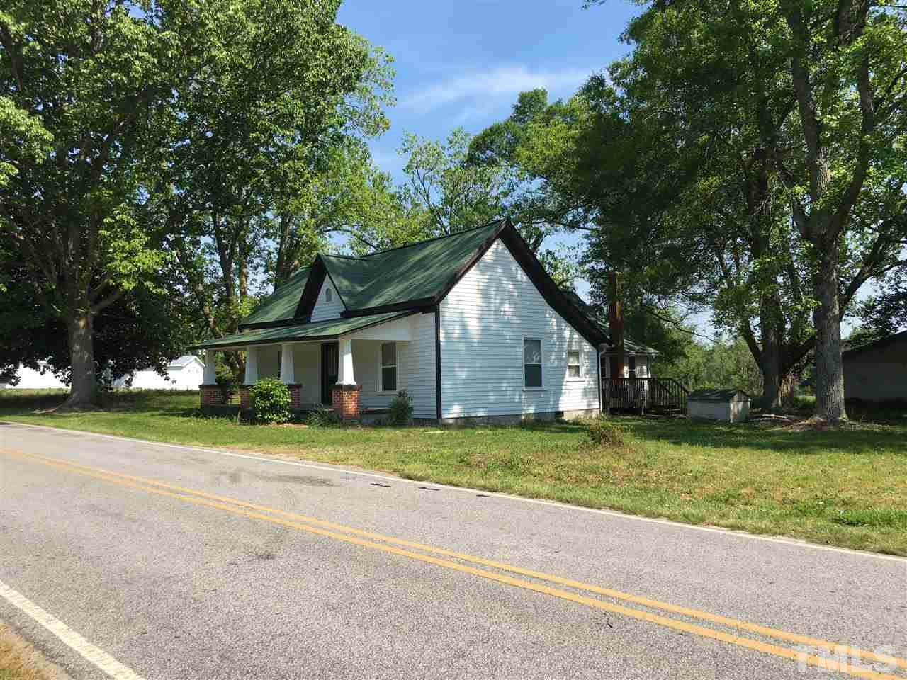 804 Pine Ridge Road Zebulon, NC 27597 - Photo 12 of 12 a front view of a house with a yard and garage