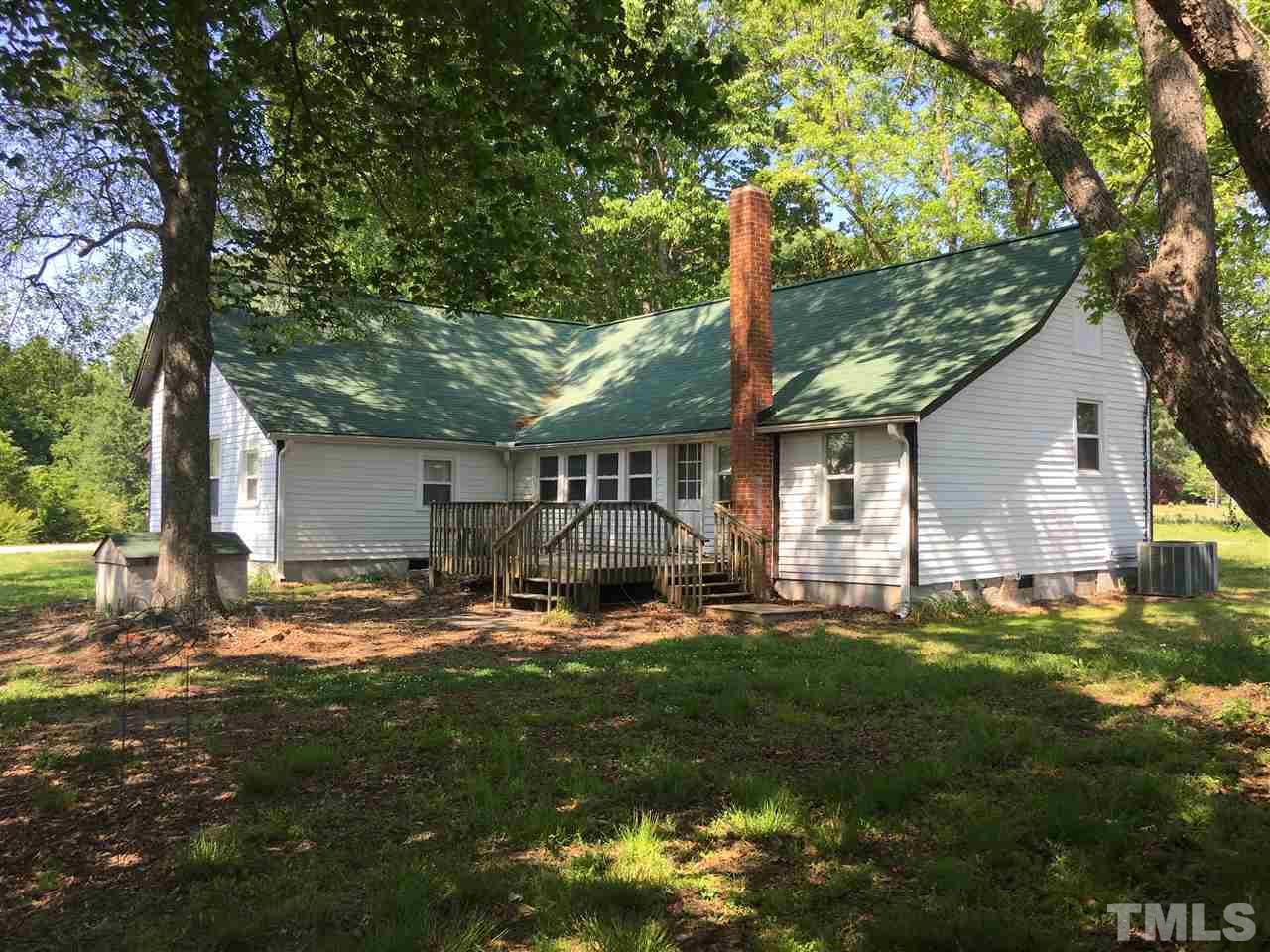 804 Pine Ridge Road Zebulon, NC 27597 - Photo 4 of 12 a front view of house with yard and green space