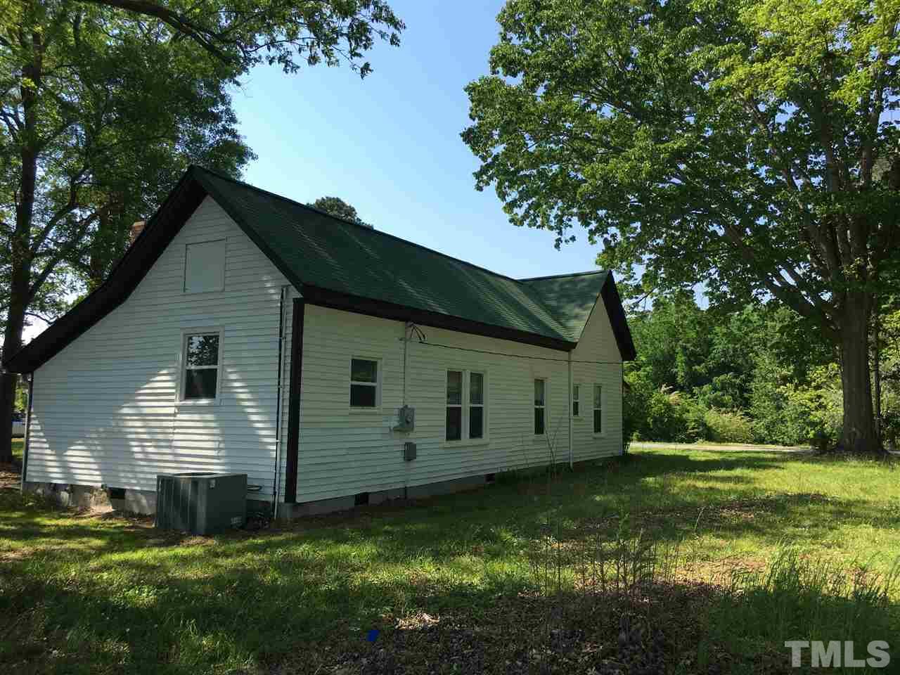 804 Pine Ridge Road Zebulon, NC 27597 - Photo 5 of 12 a view of a house with a yard