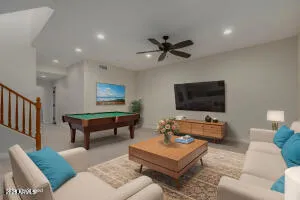 wooden floor in an empty room with a ceiling fan