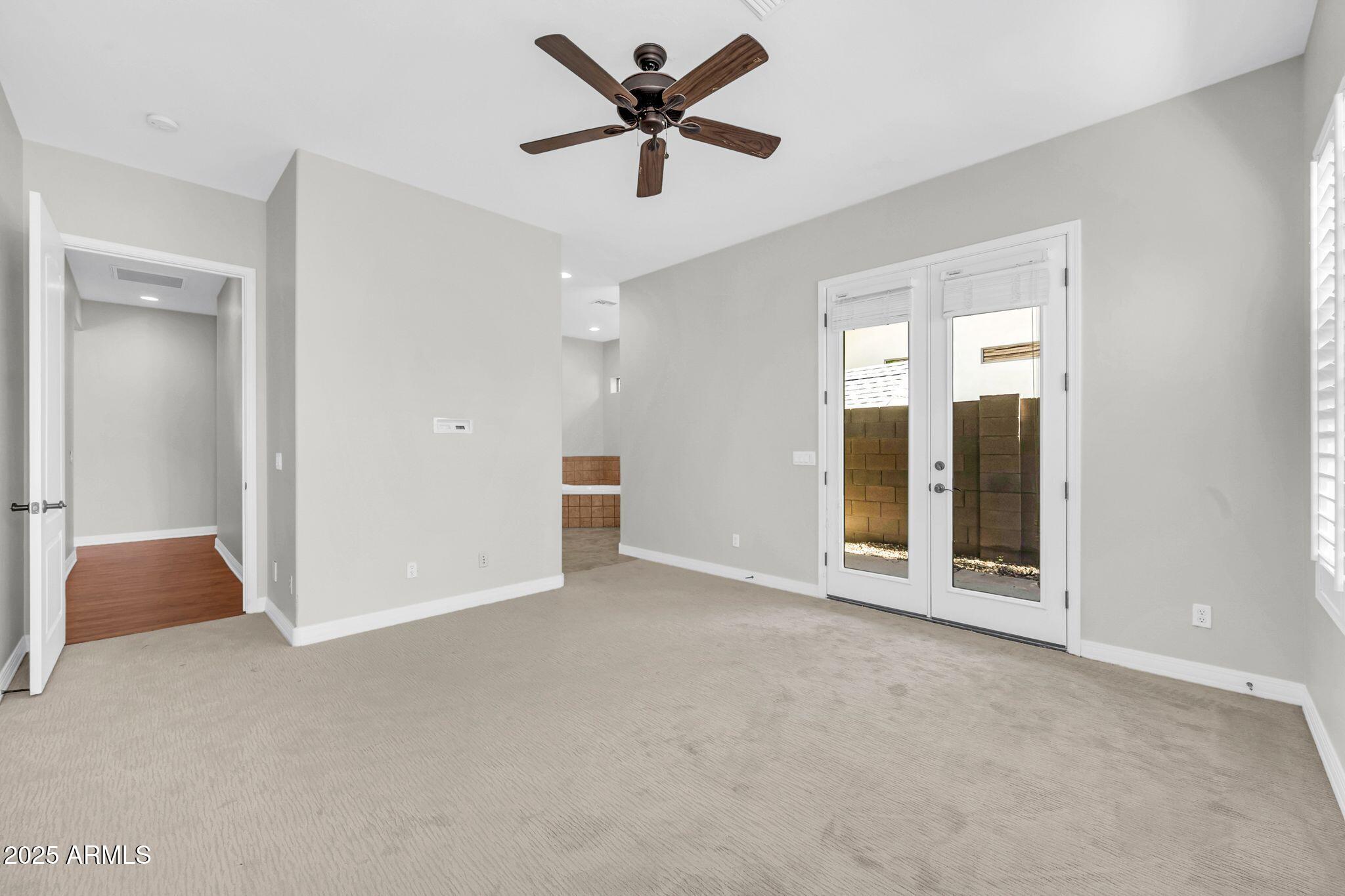 4213 East Edgemont Avenue Phoenix, AZ 85008 - Photo 20 of 35 a view of an empty room with a ceiling fan
