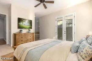 a view of an empty room with a ceiling fan