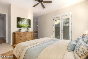 4213 East Edgemont Avenue Phoenix, AZ 85008 - Photo 21 of 35 a bedroom with a bed and a flat screen tv