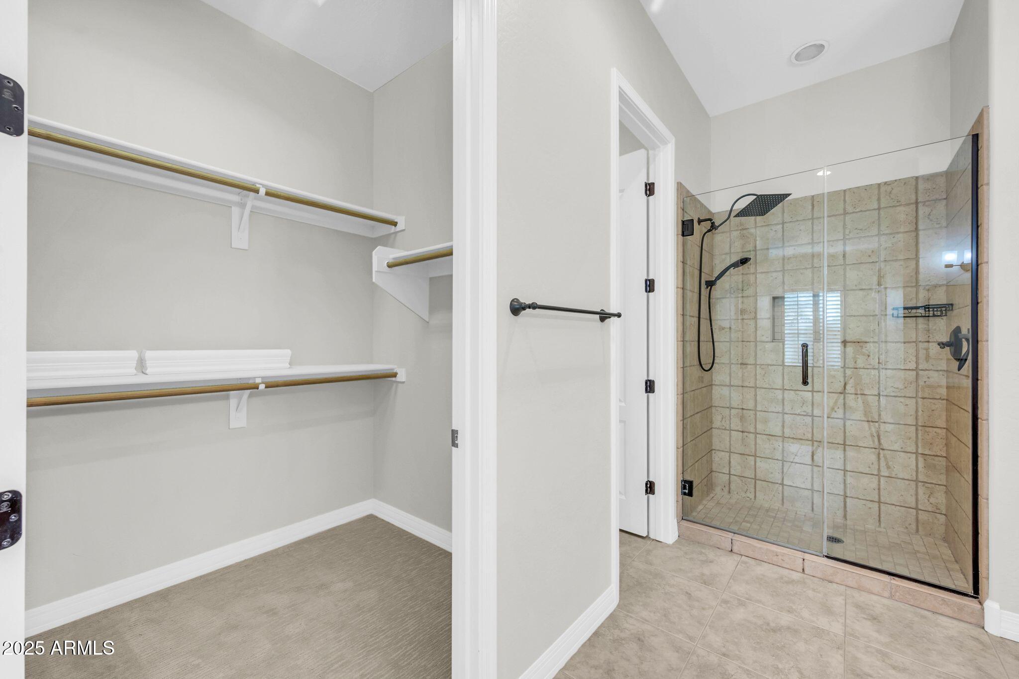 4213 East Edgemont Avenue Phoenix, AZ 85008 - Photo 23 of 35 a bathroom with a shower and a glass door