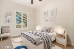 a view of a room with a ceiling fan