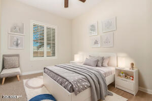 4213 East Edgemont Avenue Phoenix, AZ 85008 - Photo 27 of 35 a bedroom with a bed and a couch