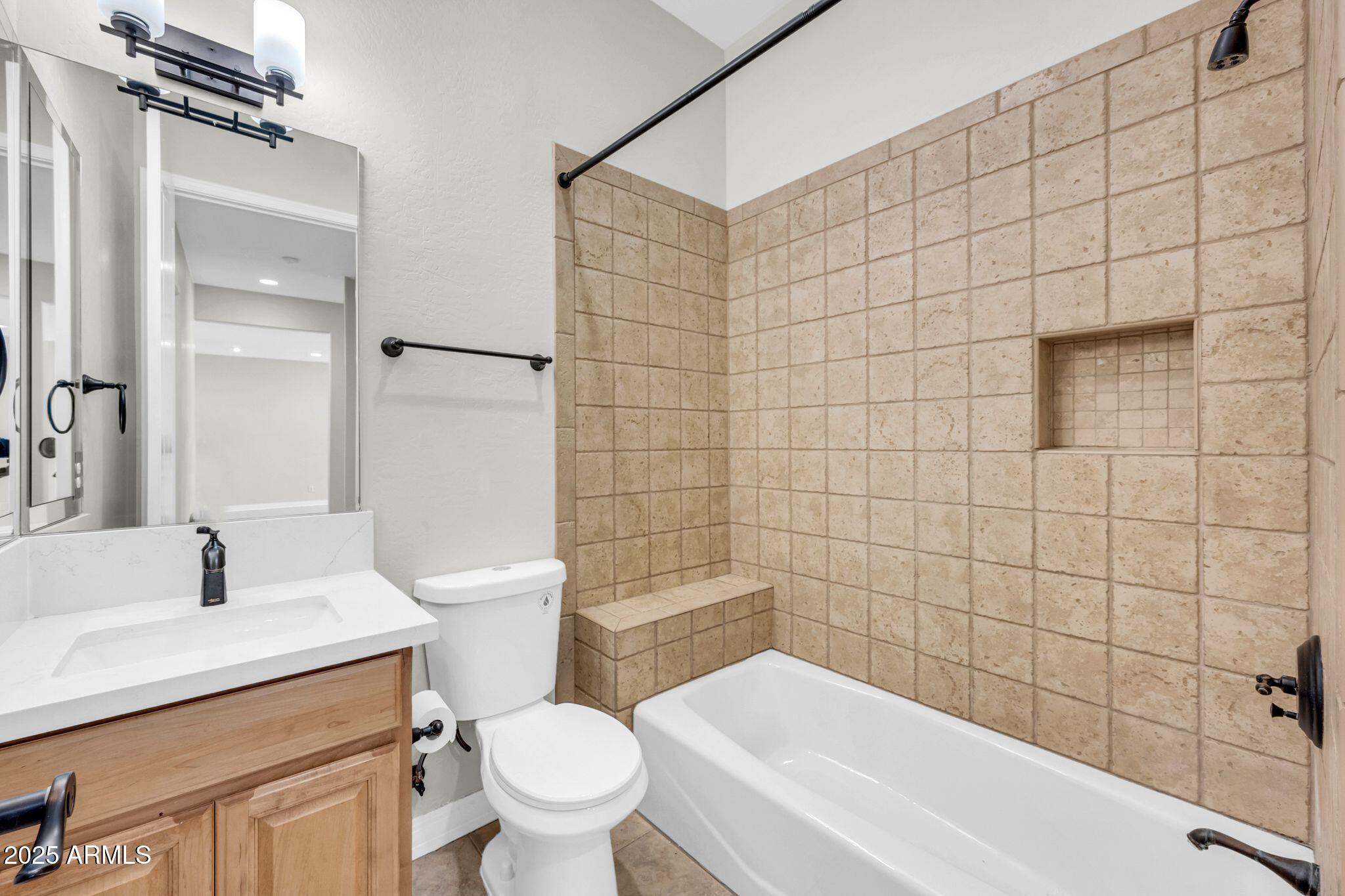 4213 East Edgemont Avenue Phoenix, AZ 85008 - Photo 28 of 35 a bathroom with a sink a toilet and shower