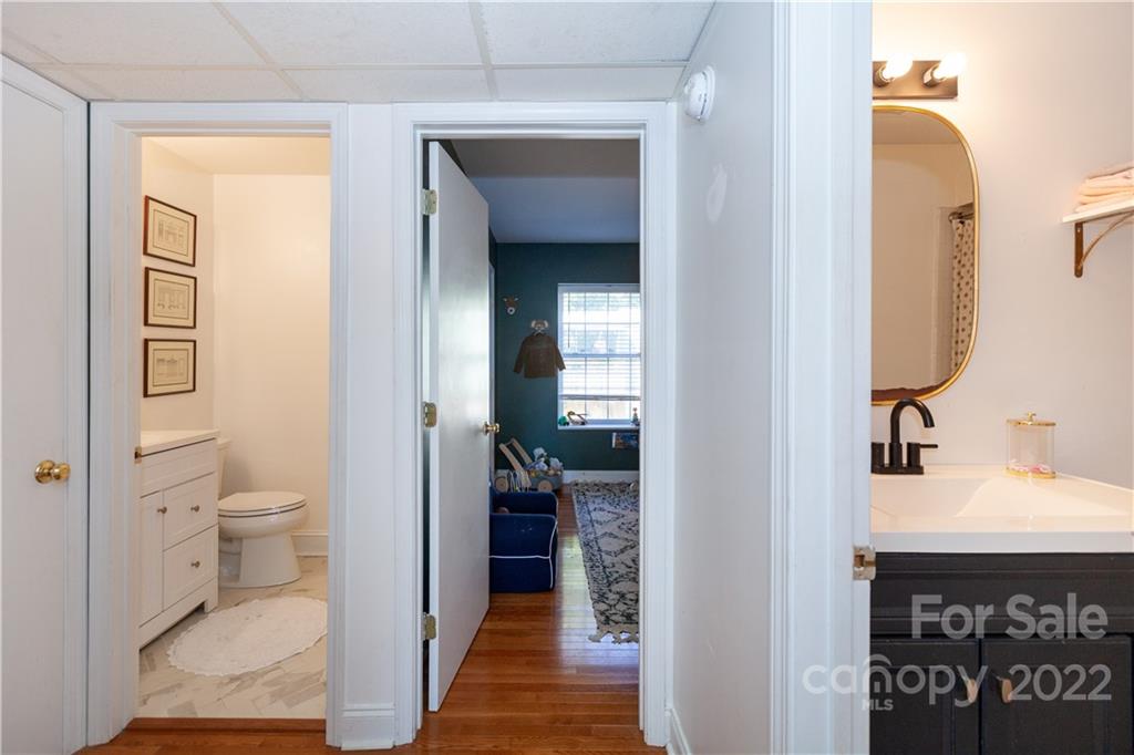 2600 Park Road, Unit C Charlotte, NC 28209 - Photo 11 of 20 a en suite bathroom with a toilet sink and a mirror