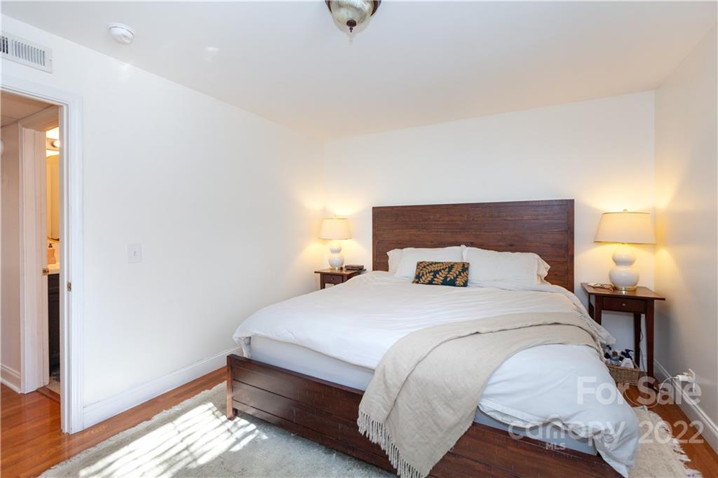 2600 Park Road, Unit C Charlotte, NC 28209 - Photo 12 of 20 a bedroom with a bed and a night stand