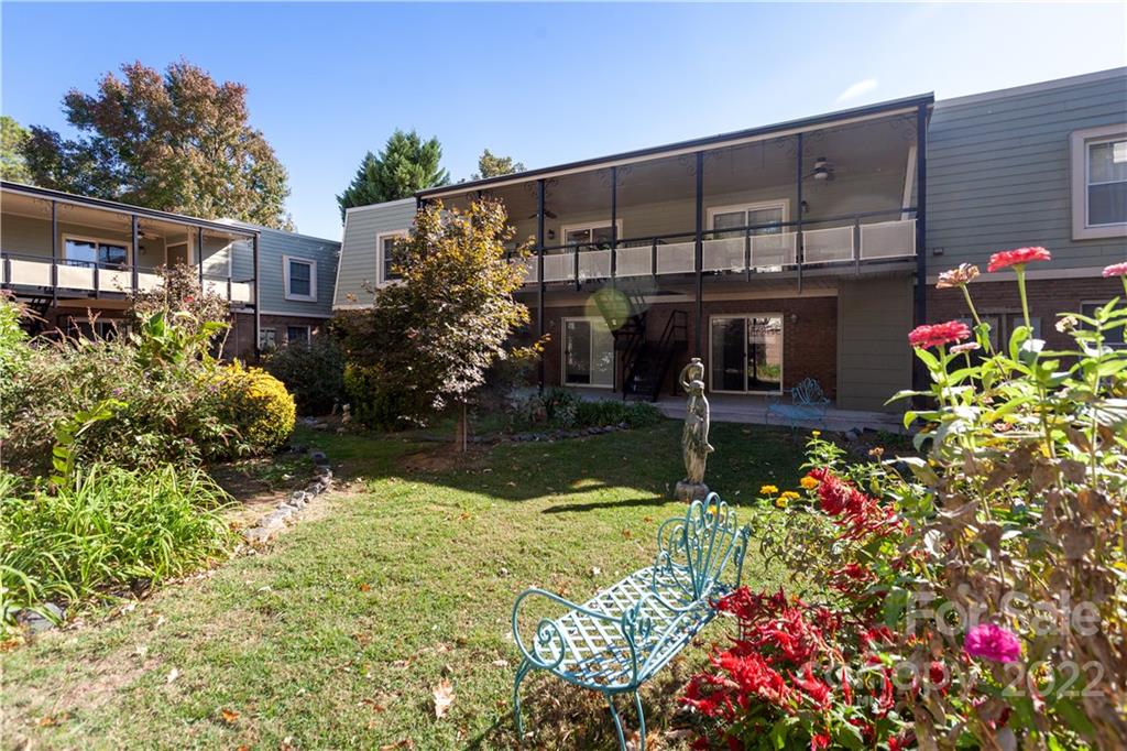 2600 Park Road, Unit C Charlotte, NC 28209 - Photo 18 of 20 a front view of a house with a yard and fountain
