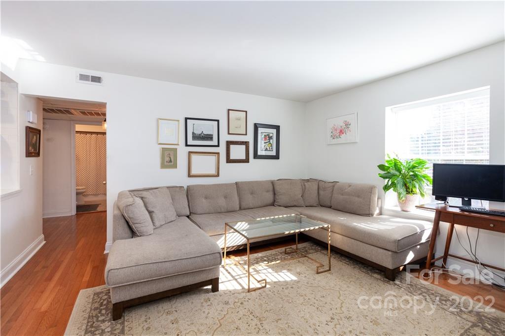 2600 Park Road, Unit C Charlotte, NC 28209 - Photo 5 of 20 a living room with furniture and a potted plant