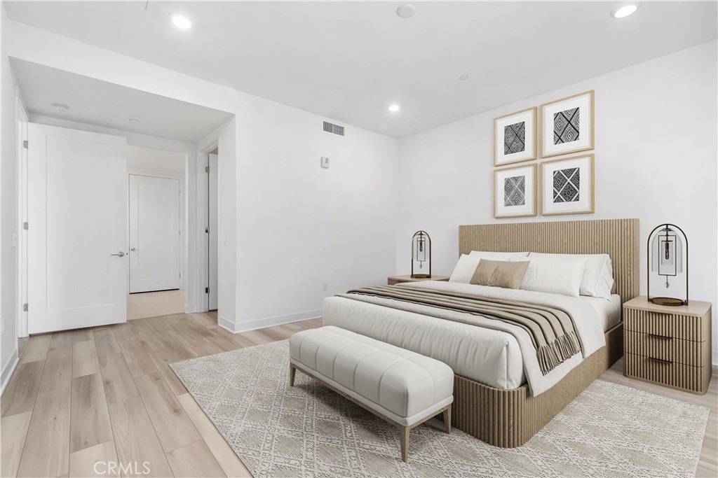 1202 Rivington Irvine, CA 92612 - Photo 12 of 52 a spacious bedroom with a bed and a couch