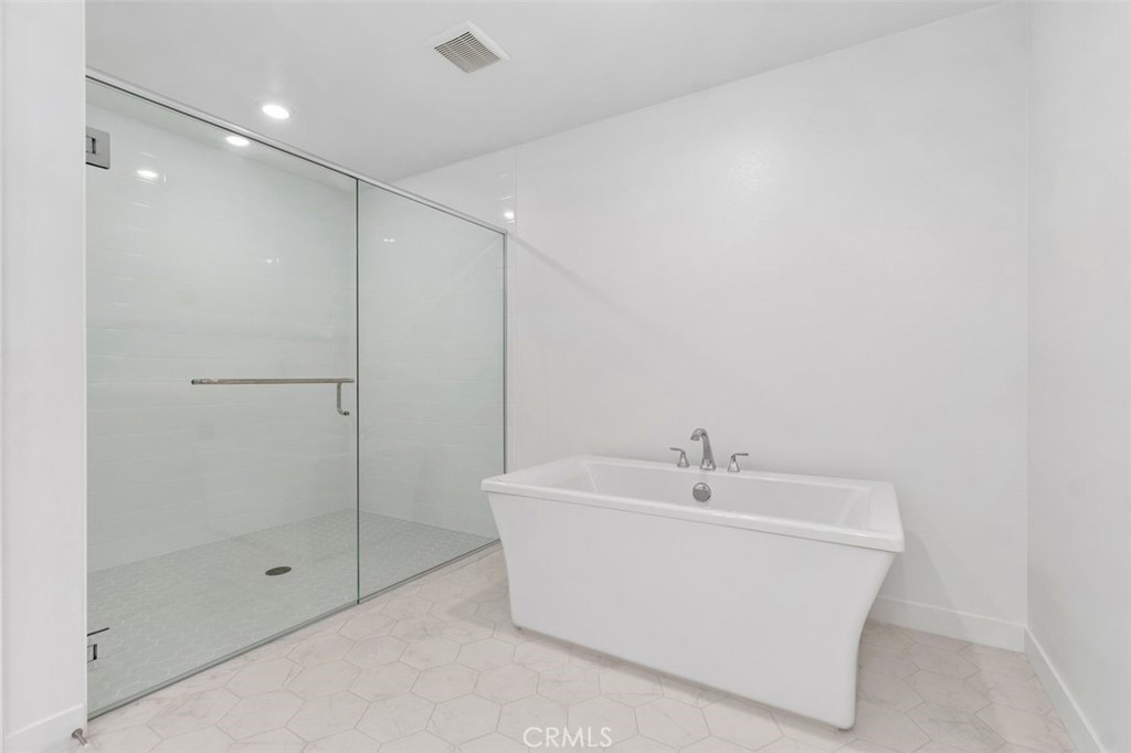 1202 Rivington Irvine, CA 92612 - Photo 13 of 52 a white bath tub sitting next to a shower